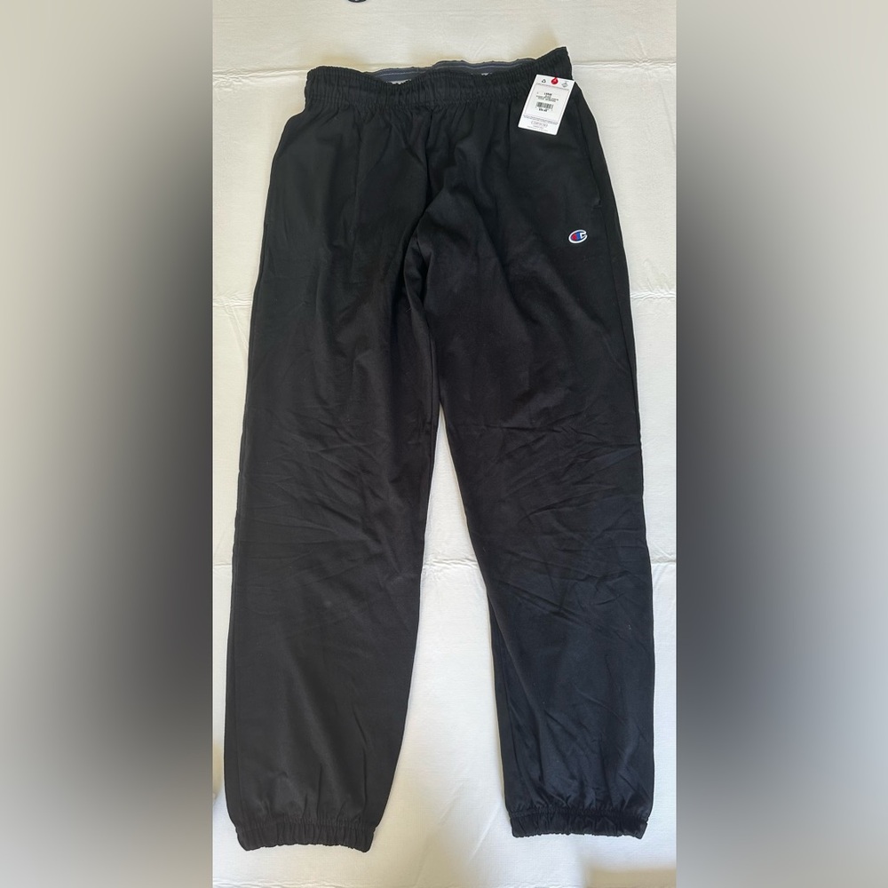 Men’s Champion black athletic pants. New with tags